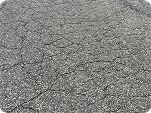 An example of alligator cracking in a road.