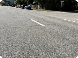 Block cracks on a road.